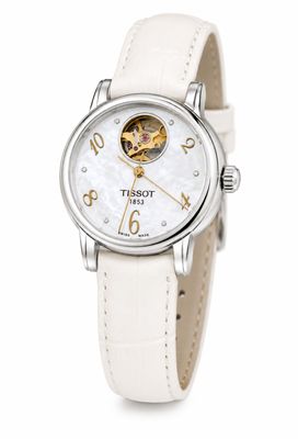 un gros plan d'une montre-bracelet avec un bracelet en cuir blanc