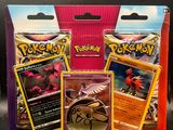 a box of pokemon cards sitting on top of a table