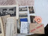 a table with a bunch of old photos and papers on it