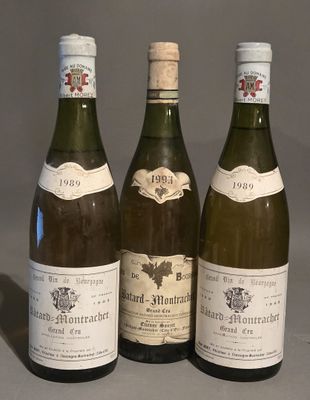 three bottles of wine sitting on top of a table next to each other