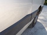 a white van parked on the side of the road