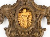 a gold clock with a picture of jesus on it