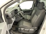 the interior of a car with the door open and the driver ' s seat down
