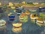 many boats in the water with a lighthouse in the background