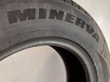 a close up of a tire on a white surface