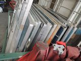 many different types of windows and doors in a warehouse