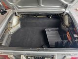a trunk of a car with a bunch of boxes in it