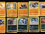 pokemon trading card game set with a lot of cards on the table