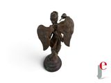 an image of a statue of an angel holding a bird on a pedestal