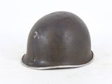a helmet that is sitting on a white surface