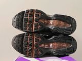 two pairs of shoes sitting on top of a box
