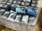 a lot of cell phones that are sitting on a table