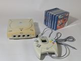 a video game system and a game controller on a table