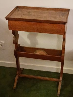 a small wooden table with a drawer underneath it