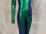 a green and blue bodysuit on a mannequin stand