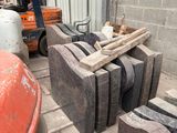 a large pile of concrete blocks sitting in a warehouse