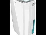 a white air purifier sitting on top of a white surface