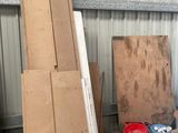 a man standing in a room with a lot of items