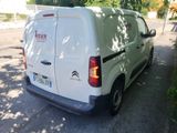 a white van that is parked on the side of the street