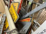a pile of street signs and signs in a store