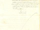 un vieux document sur lequel figure une lettre manuscrite