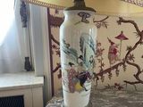 a lamp that is sitting on a table with a lamp on it