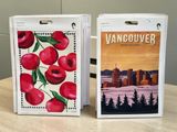 two boxes with paintings on them sitting on a table