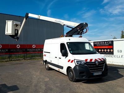 a white van that is parked in front of a building