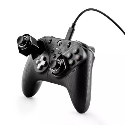 a close up of a video game controller on a white surface