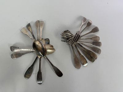a lot of silver spoons and spoon spoons on the table