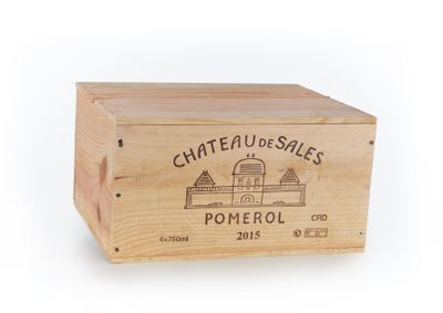 wooden box with a logo of chateau de soles pomerol on it