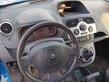 dashboard of a small car with a steering wheel and dashboard controls