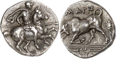 a close up of a coin with a man on a horse