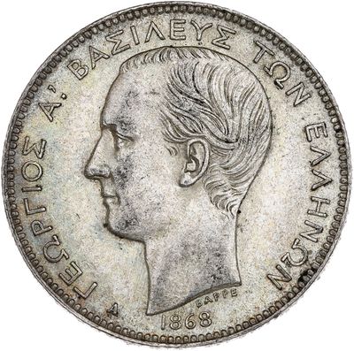 Gros plan sur une pièce de monnaie portant le visage d'un homme