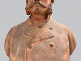 statue of a man with a mustache and a moustache on his face