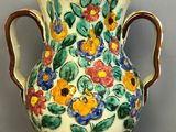 a vase that is sitting on a wooden table