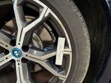a close up of a car tire with a sticker on it
