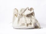 white leather bucket bag with gold hardwares on a white background