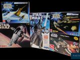 five star wars action figures on display in a row