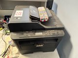 a photo of a printer sitting on top of a desk