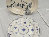 two plates with blue and white designs on them