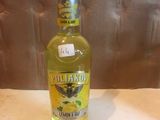 a bottle of olive oil sitting on a counter