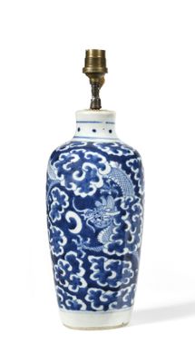 blue and white vase with a dragon design on it