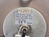 a close up of a metal object with a tag on it