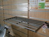 a metal shelf that has a bunch of items on it