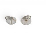 a pair of silver earrings on a white background