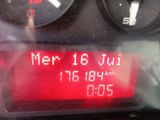 a digital clock on the dashboard of a car