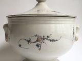 a white bowl with a floral design on it
