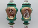 pair of green and gold vases with pictures of women on them