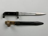 two different types of knives on a white surface